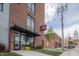 Modern apartment building entrance with brick facade and awning at 150 S Main St # 203, Franklin, IN 46131