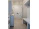 Convenient laundry room with built-in bench and storage at 150 S Main St # 203, Franklin, IN 46131