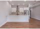 Modern kitchen features white cabinets, marble countertops, and stainless steel appliances at 150 S Main St # 203, Franklin, IN 46131