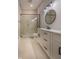 Bathroom boasts white cabinets, quartz countertops, and a walk-in shower at 150 S Main St # 203, Franklin, IN 46131