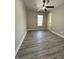 Bright bedroom with ceiling fan and gray vinyl flooring at 1628 Churchman Ave, Indianapolis, IN 46203