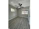 Bright bedroom with ceiling fan and gray vinyl flooring at 1628 Churchman Ave, Indianapolis, IN 46203