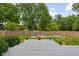 Deck overlooking a fenced backyard with garden at 7201 N Illinois St, Indianapolis, IN 46260