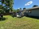 Backyard with a wooden deck and grassy area at 8528 Friendship Ln, Indianapolis, IN 46217