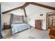 Primary bedroom with high ceilings and wooden dresser at 9790 Woodland Dr, Mooresville, IN 46158