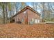 Brick house exterior with a deck and attached garage at 9790 Woodland Dr, Mooresville, IN 46158