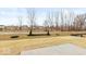 Backyard view showcasing a walking path, landscaping, and neighboring homes in the distance at 1098 Gatewick Ct, Greenwood, IN 46143