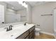 Modern bathroom with double vanity, wood-look flooring, and contemporary fixtures at 1098 Gatewick Ct, Greenwood, IN 46143