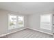 Bright, airy bedroom with large windows, neutral gray walls, and plush carpeting at 1098 Gatewick Ct, Greenwood, IN 46143