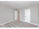Empty bedroom with gray walls, white trim, plush carpeting, and simple white doors at 1098 Gatewick Ct, Greenwood, IN 46143