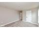 Unfurnished bedroom featuring gray walls, a white door, and neutral carpeting at 1098 Gatewick Ct, Greenwood, IN 46143