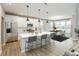 Modern kitchen features stainless steel appliances and an island with seating at 1098 Gatewick Ct, Greenwood, IN 46143