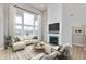 Spacious living room boasts a large fireplace and abundant natural light at 1098 Gatewick Ct, Greenwood, IN 46143