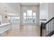 Bright living room with high ceilings, large windows, and a modern fireplace at 1098 Gatewick Ct, Greenwood, IN 46143