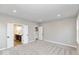 Spacious main bedroom with plush carpeting, gray walls, and ensuite bathroom access at 1098 Gatewick Ct, Greenwood, IN 46143