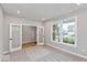 Home office or den with French doors, carpeting, and large windows at 1098 Gatewick Ct, Greenwood, IN 46143