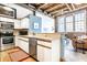 Modern kitchen with stainless steel appliances and light wood cabinets at 735 Lexington Ave # Apt 8, Indianapolis, IN 46203