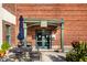 Elegant building entrance with a covered patio and landscaping at 735 Lexington Ave # Apt 8, Indianapolis, IN 46203
