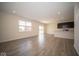 Open living room and kitchen area with hardwood floors at 91 Booth St, Whiteland, IN 46184