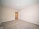 Bright bedroom with double doors and carpet at 91 Booth St, Whiteland, IN 46184