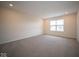 Spacious bedroom with neutral carpet and window at 91 Booth St, Whiteland, IN 46184