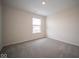 Well-lit bedroom with neutral walls and carpet at 91 Booth St, Whiteland, IN 46184
