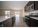 Modern kitchen with stainless steel appliances and view to backyard at 91 Booth St, Whiteland, IN 46184