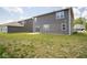 Home's backyard with grassy lawn and patio at 91 Booth St, Whiteland, IN 46184