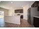 Island kitchen with stainless steel appliances and view to Gathering room at 91 Booth St, Whiteland, IN 46184