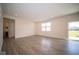 Open living room with hardwood floors and patio access at 91 Booth St, Whiteland, IN 46184