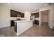 Modern kitchen featuring dark cabinetry, quartz countertops, and stainless steel appliances at 91 Booth St, Whiteland, IN 46184