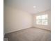 Bright bedroom with neutral wall paint and carpeted floor at 91 Booth St, Whiteland, IN 46184