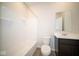 Clean bathroom with tub, toilet, vanity, and recessed shelving at 91 Booth St, Whiteland, IN 46184