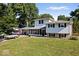 Two-story house with screened porch and landscaping at 386 Jordan Rd, Indianapolis, IN 46217