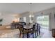 Dining area with hardwood floors and view into living room and kitchen at 1558 Wedgewood Pl, Avon, IN 46123