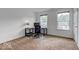 Home office with a corner desk, chair, and large window at 1558 Wedgewood Pl, Avon, IN 46123