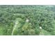 Aerial view of a property with a house, barn, and other structures, surrounded by lush green landscape at 4463 W 700 S, Trafalgar, IN 46181