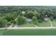 Aerial view of house, barn, and church on large lot at 4463 W 700 S, Trafalgar, IN 46181