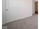 Simple bedroom with grey carpet and white walls at 3809 S Woodfield Dr, New Palestine, IN 46163