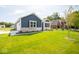 House exterior showcasing a two-car garage and well-manicured lawn at 3809 S Woodfield Dr, New Palestine, IN 46163