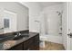 Bathroom with tub, shower, and dark vanity at 962 Westview Point Dr, Columbus, IN 47201