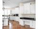 Bright kitchen with white cabinets, granite counters, and a built-in desk at 8011 Morningside Dr, Indianapolis, IN 46240