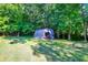 Metal storage shed nestled in the woods at 7864 W 50 S, Morgantown, IN 46160