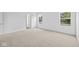 Well-lit bedroom with neutral carpeting and an ensuite bathroom at 3929 Highcrest Rd, Indianapolis, IN 46239