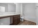 Bathroom with vanity, tub and wood-look floors at 3929 Highcrest Rd, Indianapolis, IN 46239