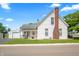 White house with brick chimney and large front yard at 407 E Thompson St, Edinburgh, IN 46124