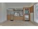 Outdoor kitchen with stainless steel grill and built-in refrigerator at 7601 S 700 W, Morgantown, IN 46160