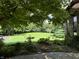 Landscaped yard with lush greenery, offering a serene and private outdoor setting at 7601 S 700 W, Morgantown, IN 46160