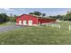 Red barn with three garage doors and white fence at 7601 S 700 W, Morgantown, IN 46160