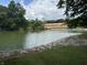 Serene pond view with a red barn in the background at 7601 S 700 W, Morgantown, IN 46160